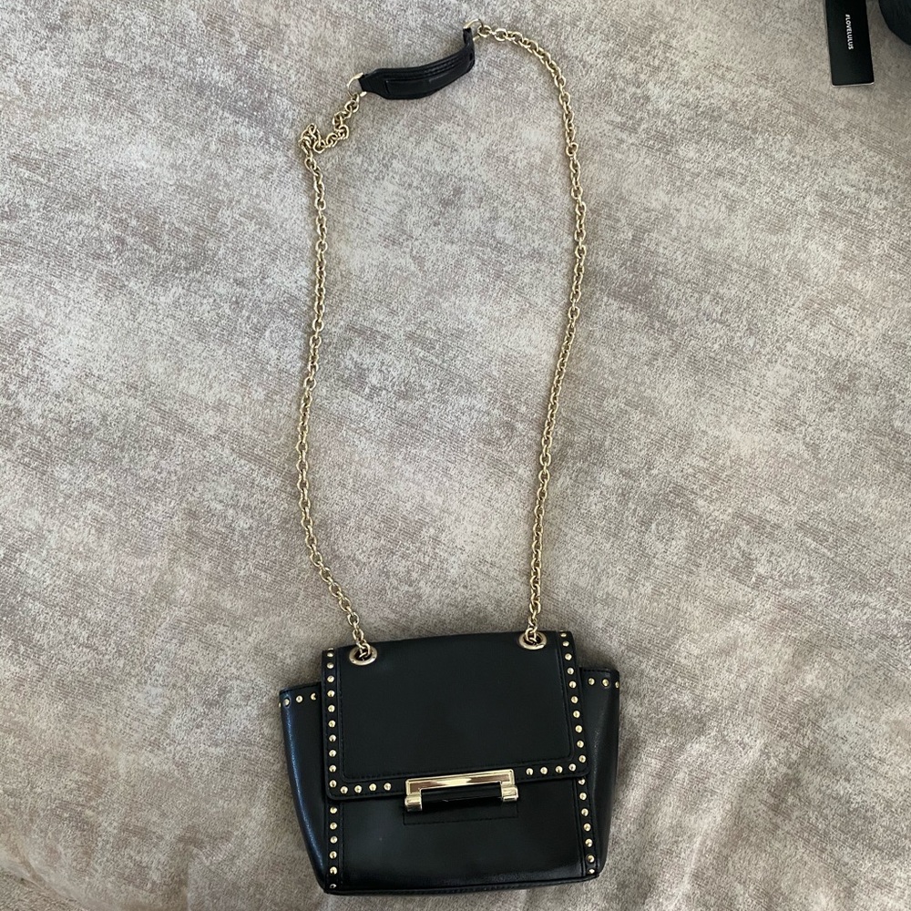 Black and gold leather DVF purse